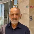 توپ و چوب، بازی مرسوم اهالی محله نوده در باغ نو